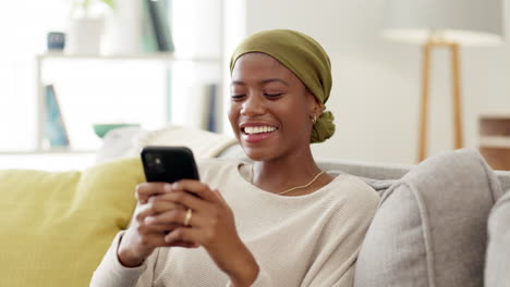 Phone,-black-woman-and-happy-texting-on-a-sofa