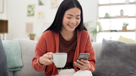 Coffee,-cellphone-and-Asian-woman-on-a-sofa