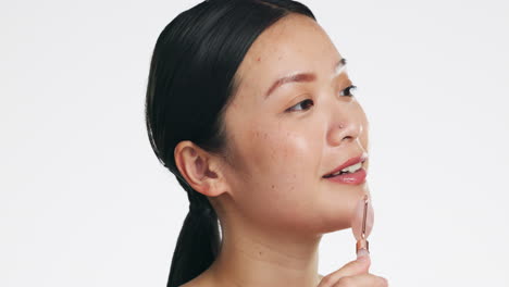 Asian-woman,-roller-and-face-for-skincare-beauty