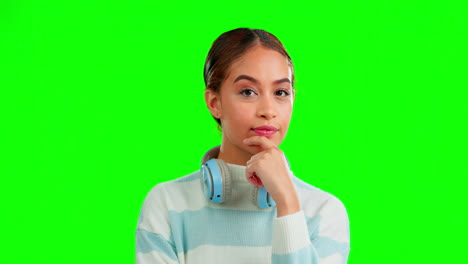 Thinking,-headphones-and-woman-on-a-green-screen