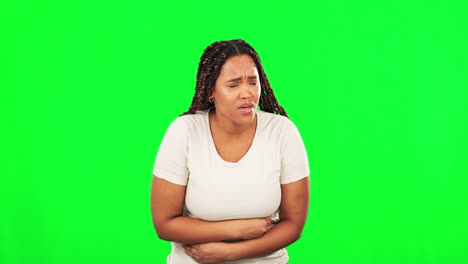 Black-woman,-hands-or-stomach-pain-on-studio-green