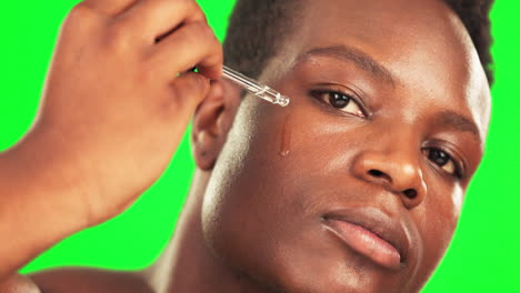 Black-man,-face-oil-and-green-screen-for-skincare