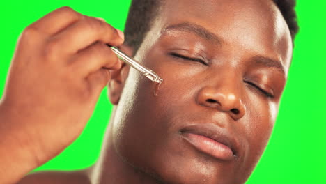 Black-man,-serum-oil-and-green-screen-for-skincare