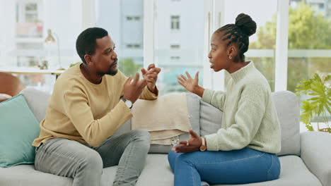 Black-couple,-argument-and-talking-on-sofa