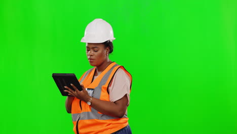 Female-engineer,-tablet-and-studio-by-green-screen