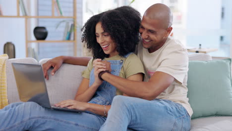 Laptop,-couple-and-high-five-on-sofa-in-home