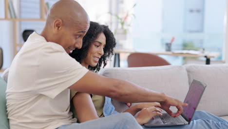 Laptop,-couple-and-online-shopping-on-sofa-in-home