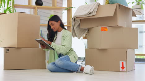 Digital-tablet,-boxes-and-woman-moving-to-a-modern