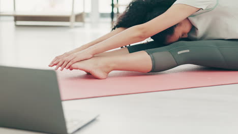 Woman,-laptop-and-stretching-for-home-workout