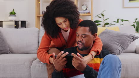 Black-couple,-tablet-and-hug-relaxing-by-sofa