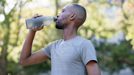 Fitness,-drinking-water-and-man-in-a-park
