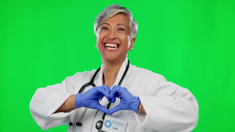 Doctor,-heart-and-hands-with-woman-on-green-screen