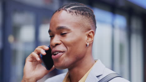 Phone-call,-happy-face-and-city-black-man-talking