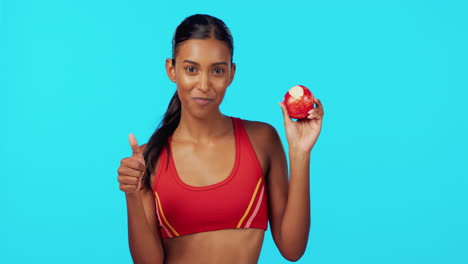 Health,-apple-and-thumbs-up-with-woman-in-studio