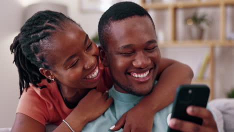 Phone,-home-and-black-couple-laugh-on-sofa