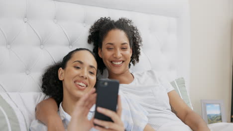 Phone,-bed-and-happy-couple-of-friends-relax