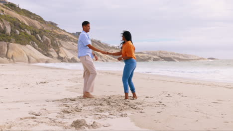 Beach,-dance-and-couple-with-happiness-on-sand