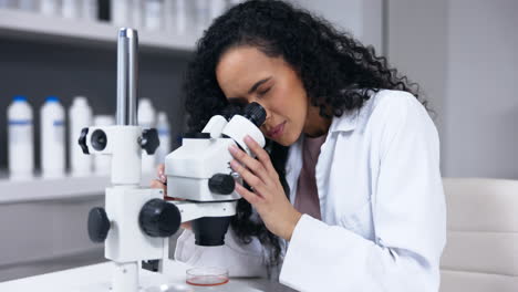 Scientist,-woman-and-microscope-with-analysis