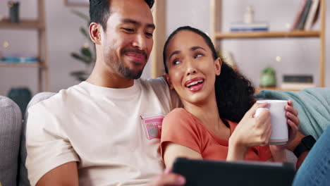 Love,-relax-and-couple-on-sofa-with-digital