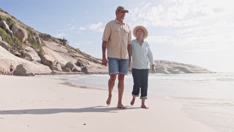 Love,-beach-and-senior-couple-walking-by-the-sea