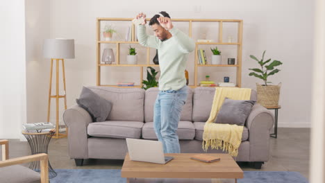 Man,-dancing-and-listening-to-music-in-living-room