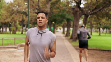 Man-breathing,-running-and-outdoor-park