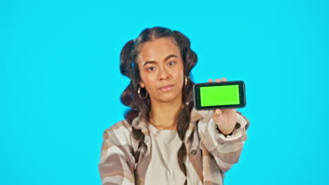 Phone,-green-screen-and-serious-woman-in-studio