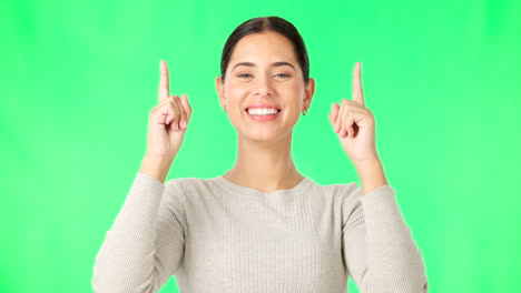 Smile,-face-and-woman-on-green-screen-pointing-up