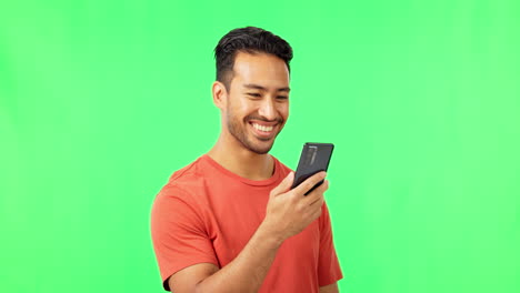 Happy,-browsing-and-phone-with-asian-man-on-green