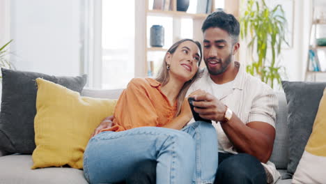 Couple,-phone-and-relax-on-sofa-with-social