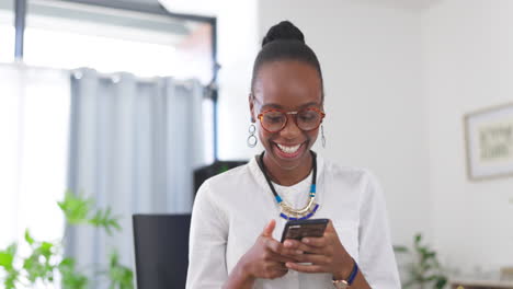 Black-woman,-phone-and-laughing-at-the-office