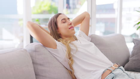 Woman,-relax-and-hands-behind-head-on-couch