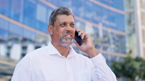 Senior-executive,-man-in-city-with-phone-call