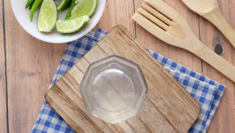 Refreshing-lemon-water-drink-on-table-,-top-view