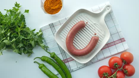 Top-view-of-sausage-and-vegetables-on-table-,
