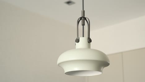 Gray-ceiling-lamp-hanging-in-a-room