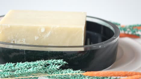 Homemade-natural-soap-bar-on-black-background