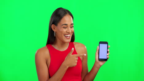 Woman,-green-screen-and-point-at-phone