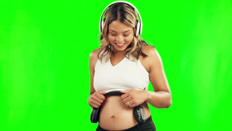 Happy,-pregnant-woman-or-headphones-on-belly