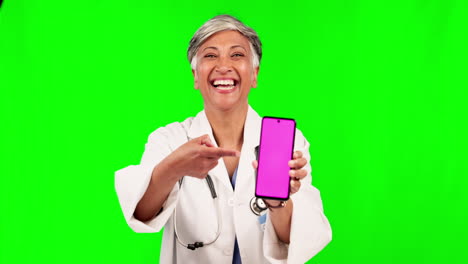 Doctor,-pointing-and-phone-on-green-screen
