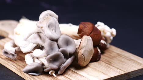 Mixed-mushroom-on-chopping-board-,