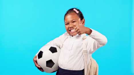 Girl-child,-soccer-ball-and-studio-for-thumbs-up