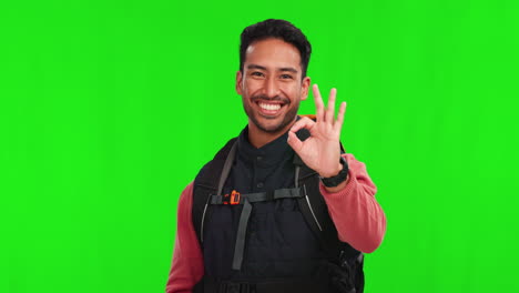 Asian-man,-hiker-and-okay-hand-sign-on-green