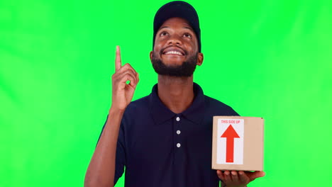 Happy-black-man,-box-and-pointing-up-on-green