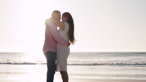 Beach,-hug-and-couple-kiss-at-sunset-at-the-ocean