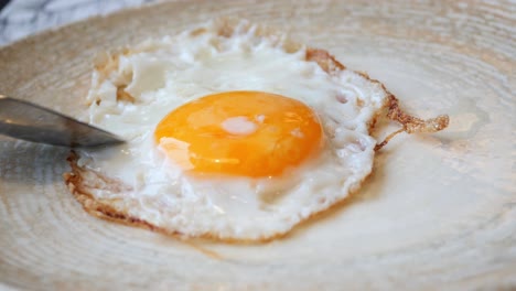 Fried-eggs-in-the-plate-close-up-,,