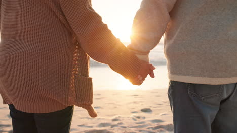 Sunset,-beach-and-closeup-of-couple-holding-hands