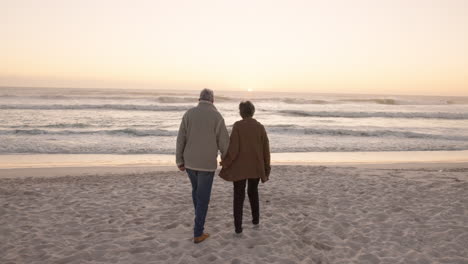 Walking,-beach-and-senior-couple-holding-hands-by