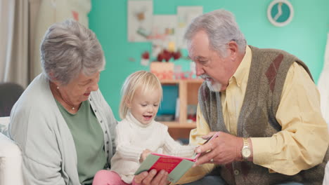 Kid,-reading-and-grandparents-with-helping
