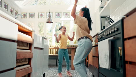 Freedom,-kitchen-and-mom-dancing-with-her-daughter